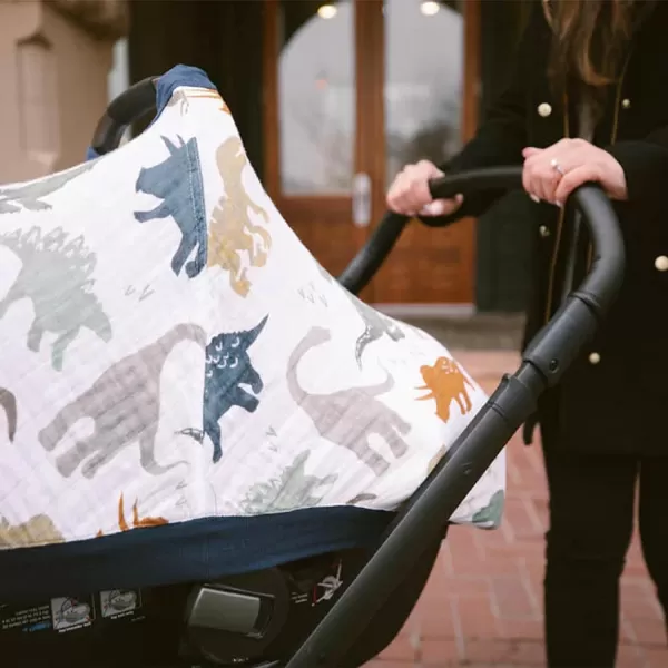 imageLittle Unicorn 100 Cotton Muslin Car Seat Canopy  Super Soft Lightweight Cover with Window  Breathable  Magnetic Closure  Baby and Infant  Machine Washable  Shower Gift  Dino FriendsDino Friends