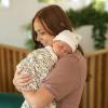 imageLittle Unicorn Large Stretch Knit Swaddle Blanket 2 Pack Super Soft with Optimal Stretch for swaddling  Giftable Set Dino PalsPressed Petals