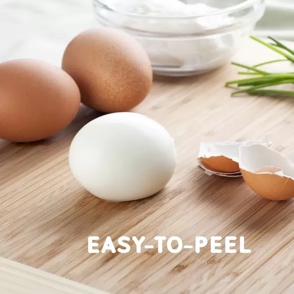 imageElite Gourmet EGC322CW Easy Egg Cooker Electric 7Egg Capacity Soft Medium HardBoiled Egg Cooker with Auto ShutOff Measuring Cup Included BPA Free Classic WhiteClassic White