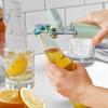 imageKitchenAid Classic Multifunction Can Opener and Bottle Opener Easy to Use Razor Sharp Stainless Steel Cutting Wheel Soft Ergonomic Handles CharcoalPistachio