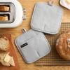 imageKITCHENAID Gourmet Series Gridlines Pot Holders 2Pack Set Heat Resistant up to 600F Soft Silicone Grip Magnetic Cuff Passion Red 8quotx8quotMatte Grey